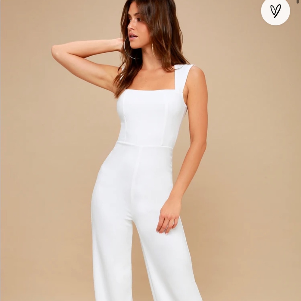 Unworn white jumpsuit perfect condition with tags